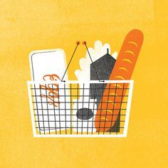 a basket filled with carrots and other items on top of a yellow wall next to a cell phone