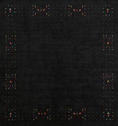 a black area rug with multicolored dots in the center and on the bottom