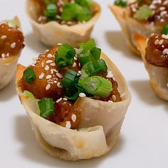 small appetizers with meat and green onions on them