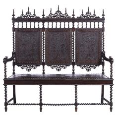 an old wooden bench with ornate carvings on the back and sides, isolated against a white background