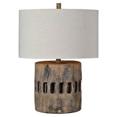 a wooden table lamp with a white shade