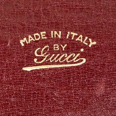 an old red book with the words made in italy written on it