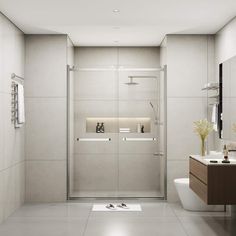 a bathroom with a toilet, sink and shower stall in the middle of the room