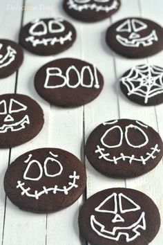 chocolate cookies decorated to look like halloween faces