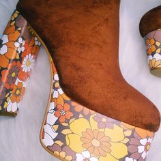 Elevate your style with the Suede Floral Platform Boots, a spin-off of the best-selling Suede Platform Heels. These boots feature a stunning '70s-inspired floral print on the platform, combining vintage charm with contemporary flair. Stunning '70s-inspired floral print on the platform for a unique and eye-catching look Crafted from high-quality suede for a luxurious feel and durability Perfect for nights out or adding retro glamour to everyday outfits. Retro Glamour, Nectarine, The Platform, 70s Inspired, Platform Boots, Elevate Your Style, Platform Heels, Vintage Charms, Everyday Outfits