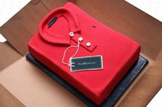 a red shirt and tie cake in a box