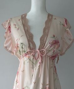 Stunning vintage 70s nightie/lingerie, and deadstock on top of it all! Adding a slip could easily turn it into a day dress. Still has original hang tags attached at the left arm. Sheer, nylon, adjustable in the under bust. Light pink, airy, dreamy ruffled shoulders. Flawless condition. Plenty of stretch.  Shoulders 15" Chest 19-21" (stretches) Ribs/underbust adjustable with tie Length (shldr to hem) 53" I would say this would suit anyone XS-M.  Super romantic and gorgeous! NEW ITEMS WEEKLY!  Come visit me on Instagram to have access to items before they are posted to the Etsy shop.  @rubyhausvintage All of the items I sell are pre-loved, which means that signs of wear are to be expected.  This brings unique character to an item! I do my best to note any major flaws I find in the item descr Fitted Coquette Nightgown, Fitted Sheer Sleepwear For Loungewear, Sheer Coquette Summer Nightgown, Sheer Fitted Coquette Sleepwear, Spring Coquette Lace Sleepwear, Sheer V-neck Coquette Sleepwear, Spring Sheer Coquette Nightgown, Sheer Fitted Nightgown For Spring, Coquette Nightgown With Lace Trim