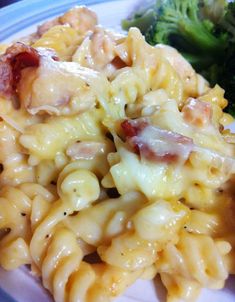 a plate with pasta and broccoli on it