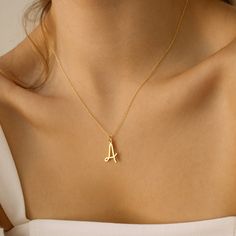 No need to spell it out — Wear your initial, your bestie’s, or your pet’s with this understated necklace. A playful take on a youthful Parisian inspired font, the Nella Letter Necklace is perfect for layering for a personalized, elevated look. Material: High Quality Solid 925 Sterling Silver Finish: Sterling Silver ∙ 18K Gold ∙ Rose Gold Featuring 8 - 10mm Initial Pendant SKU: MM-NM13F101 Pendant With Initials, Letter A Gold Necklace, Pendant Ideas Gold, Letter Gold Pendant Necklace, A Initial Pendant, A Letter Jewellery, Letter Necklace Gold Initial Pendant, Elegant Letter Initial Necklace, A Necklace Letter