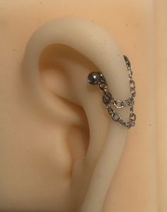 an ear with a chain attached to it