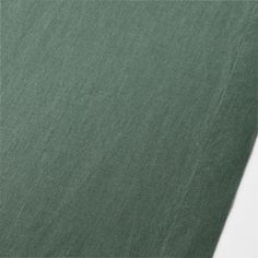 an image of a plain green fabric