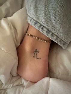 a person with a small tattoo on their foot