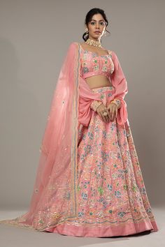 Candy floss pink raw silk lehenga with attached cancan, featuring hand embroidered floral puzzle patterns with cutdana and colorful sequins. Comes with embroidered padded blouse and dupatta.
Component: 3
Pattern: Hand Embroidered
Type Of Work: Floral Pattern, Sequins Cutdana
Neckline: Sweetheart
Sleeve Type: Puff Sleeve
Fabric: Raw Silk, Silk Organza
Color: Pink
Other Details: 
Floral patters
Embroidered cuffs
Back sheer panel
Approximate product weight: 4.5-5 Kg
Occasion: Bride, Wedding - Aza F Embroidered Cuffs, Raw Silk Lehenga, Padded Blouse, Candy Floss, Silk Lehenga, Silk Organza, Bridal Lehenga, Bride Wedding, Raw Silk