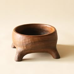 a wooden bowl sitting on top of a table