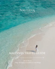 the nautilus magazine cover features a woman walking in the sand at the beach