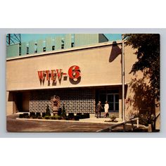 an old photo of the front of a store