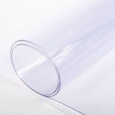 a clear plastic sheet with a thin round ring on the end and an empty circle at the top