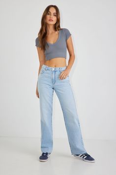 This essential 90’s look has never stopped serving. High rise and semi-fitted for a booty throwback that simply won’t quit, these straight leg jeans come in authentic non-stretch denim. We're totally replicating your favorite style from the past. Features - Five-pocket styling - Zip fly - Raw hem Size & Fit - Fit: Straight - Rise: 11" - Inseam: 32" - Model is wearing size 1 Materials & Care - Content: 75% cotton, 25% organic cotton - Care: Wash cold, inside out - Imported Best Dress Shops, Garage Clothing, Womens Jeggings, Autumn Outfit, Mid Rise Jeans, Washed Jeans, Retro Look, Style Retro, Simple Outfits