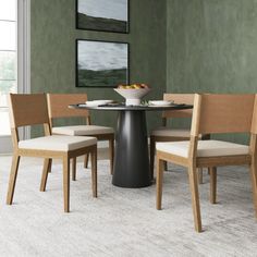 a dining table with four chairs around it