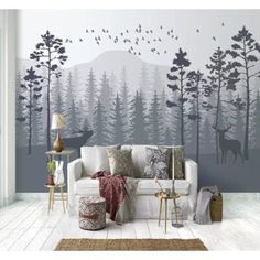 a living room filled with furniture and wallpaper covered in deer decals on the walls