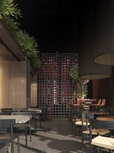 the interior of a restaurant with tables and chairs in front of a wooden wall that has red wine bottles on it