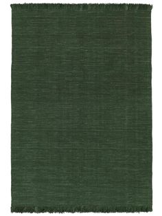 a dark green rug with fringes on top