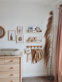 a baby's room is decorated in neutral colors