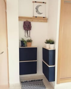 a room with two blue drawers and a rug on the floor in front of it