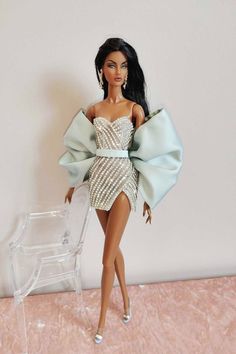 a barbie doll wearing a dress and heels