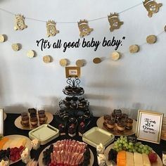 a baby shower is set up with food and desserts on the table for it's all good baby