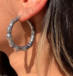 Silver Bamboo Hoop Earrings Hoop size: 6mm x 45mm Height: 45.000mm Length: 45.000mm Weight: 0.560oz Clasp: Hinged  Thank you for visiting and supporting our small business! We hope you will find a stylish piece that speaks to you! ♥ All of our piece our carefully curated and handmade by our all-female team in Miami, Fl ♥ Our materials are ethically sourced for durability About us: ♥ MaLi Beads was started 10 years ago by two sisters while in high School. What started as a hobby became a business Silver Bamboo Earrings, Chunky Silver Hoop Earrings, Hoop Earrings Large, Bamboo Hoop Earrings, Expensive Jewelry Luxury, Bamboo Earrings, Beaded Boxes, Earrings Large, Hammered Gold