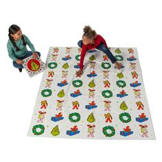 two children are playing on a play mat