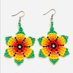 the beaded flower earrings are made from seed beads and have colorful flowers on them