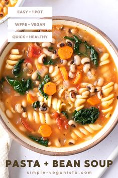 pasta and bean soup with spinach in a bowl