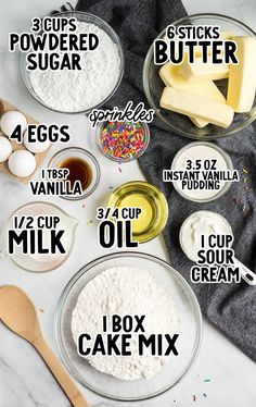 ingredients to make cupcakes and cake mix in glass bowls on a marble counter top