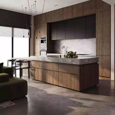 a modern kitchen with an island counter top