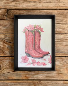 a painting of pink boots with flowers on the floor in front of a wooden wall