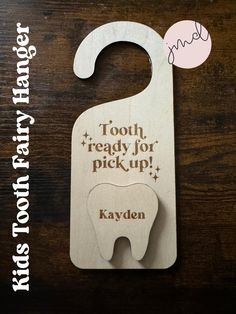 a wooden door hanger with the words tooth ready for pick up