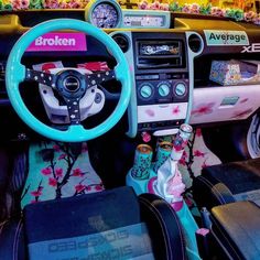 the interior of a car decorated with various items