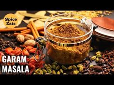 spice eats garam masala in a glass jar surrounded by spices