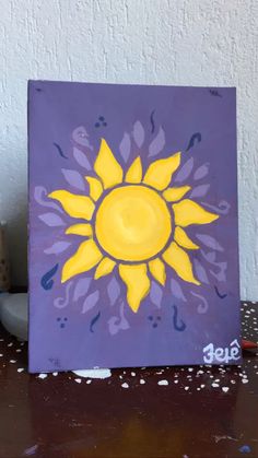 a painting of a yellow sun on a purple background