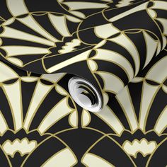 black and gold art deco wallpaper with an intricate design on the front, back and sides