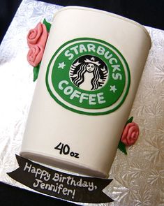 a starbucks coffee cake with pink roses on the bottom and white frosting in the middle