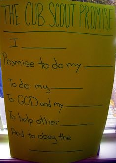 a child's handwritten note to the cub scout from his mother, in front of a window