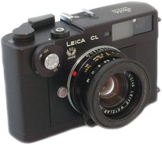 the leica cl camera is black and has a lens attached to it's body