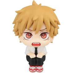 an anime figurine is sitting on the ground with his legs crossed and eyes open