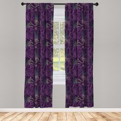 a purple curtain hanging in front of a window