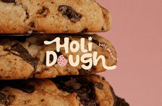 chocolate chip cookies stacked on top of each other with the word hol dush written above them