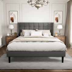 a bedroom with a bed, nightstands and two lamps on either side of the bed