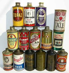 an assortment of old beer cans are arranged in a pyramid on a white background,